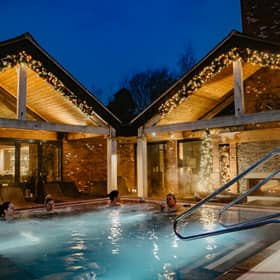 The heated outdoor vitality pool is at the heart of the Moddershall Oaks spa experience, with countryside views and cocktails delivered straight to the water.