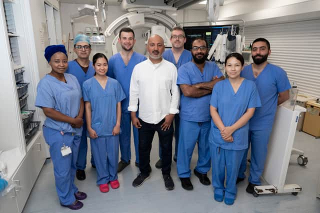 Zehair Ayub with Dr Fathallah Islim and the theatre team who provided his treatment.