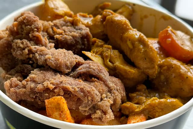 Curry chicken and fried chicken with spiced fries.