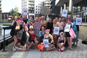 25th August 2026
A community protest swim will take place at Leeds Dock on Tuesday 25 August at
Swimmers and supporters are calling for the reinstatement of the site's open water swimming licence, the return of a safe swimming space in Leeds, and the creation of more accessible blue-space swimming areas across the city.
Pictured protestors gather at  Leeds Dock before the swim
Picture Gerard Binks