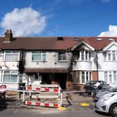 The scene outside a fire damaged property following the fire on Berkeley Avenue in Hounslow 