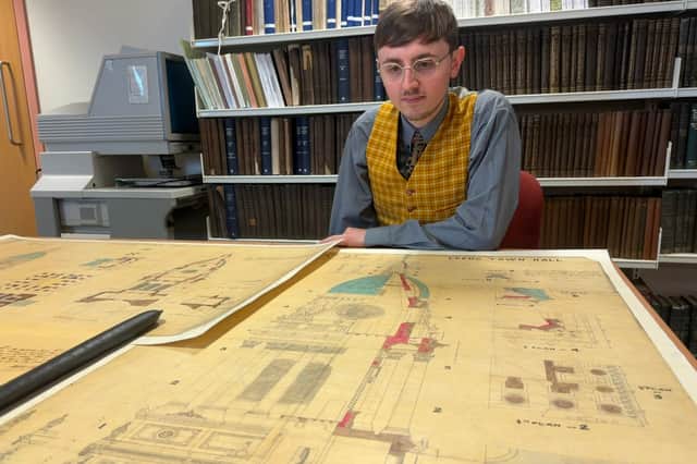 Alex Pearson, archives assistant with West Yorkshire Archive Service, with the plans. 