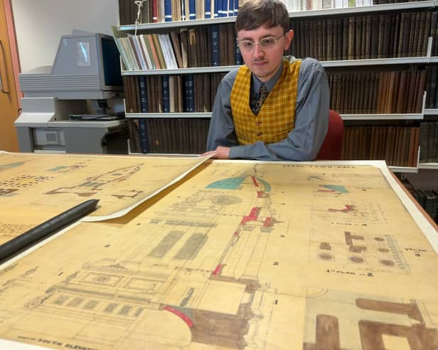 Alex Pearson, archives assistant with West Yorkshire Archive Service, with the plans. 