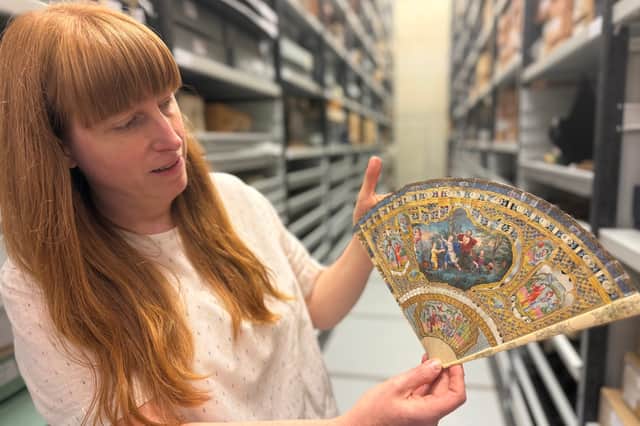 Natalie Raw, Leeds Museums and Galleries’ curator of costume, with a collection of fans.