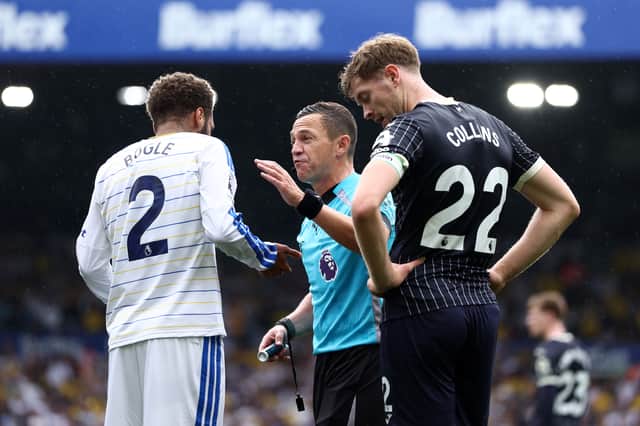 Referee Tony Harrington waved away Brentford penalty claims.