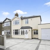 The Nook Road frontage features a block-paved driveway with space for multiple vehicles and an integrated single garage