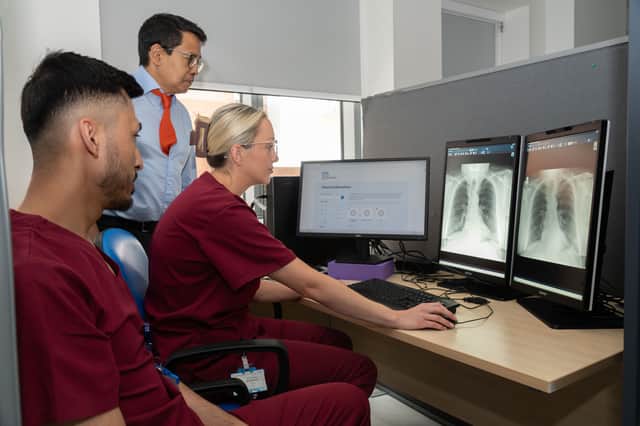Dr Bobby Bhartia, Consultant Radiologist (pictured centre), with two radiographers based at St James’s Hospital in Leeds.