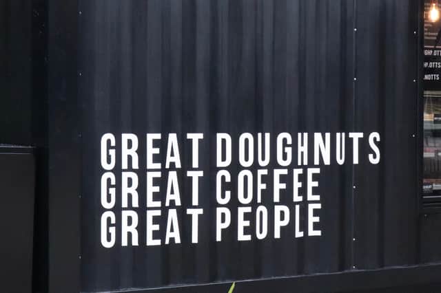 The brand slogan is "great doughnuts, great coffee, great people"