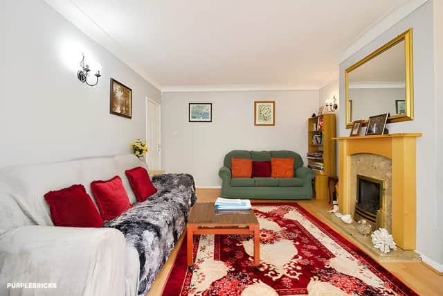 The bright lounge opens into the conservatory, creating a connected living space with views towards the rear garden
