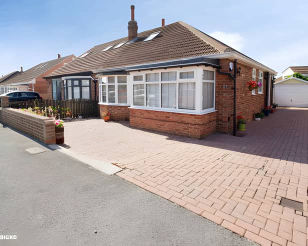 The bungalow is set back from High Moor Crescent behind a block-paved driveway and landscaped frontage