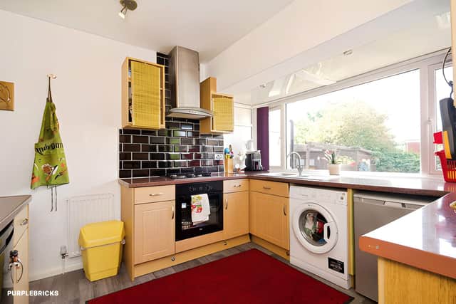 A modern fitted kitchen provides practical storage and space for essential appliances alongside its built-in oven and gas hob