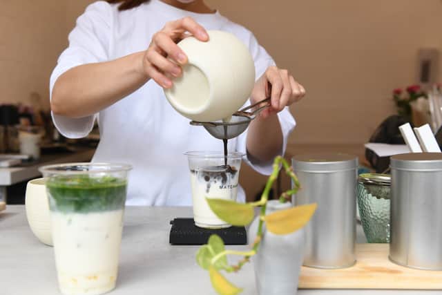 Shweyi Tun preparing the drinks