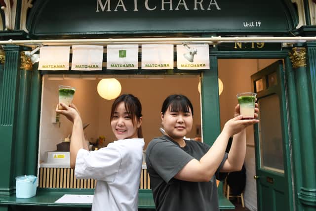 Co-owner Shweyi Tun and staff member Hina Tsubosalui with Matchara drinks outside the shop in Kirkgate Market