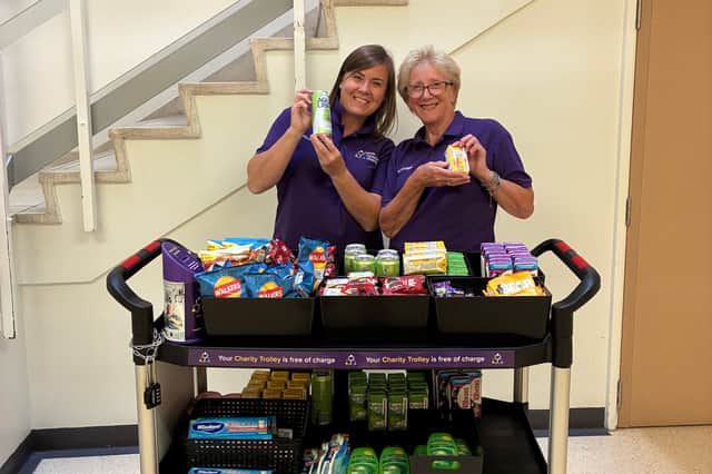 Trolley volunteers Kirsty and Sally with the Charity Trolley.