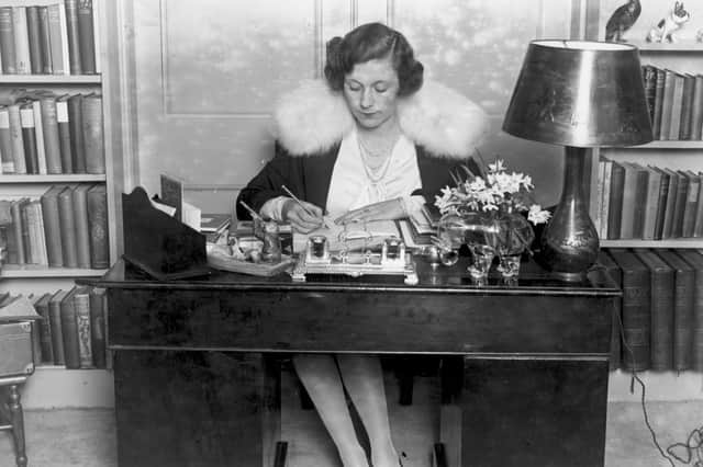 A pre-"dictating style" Barbara Cartland behind her desk, circa 1928