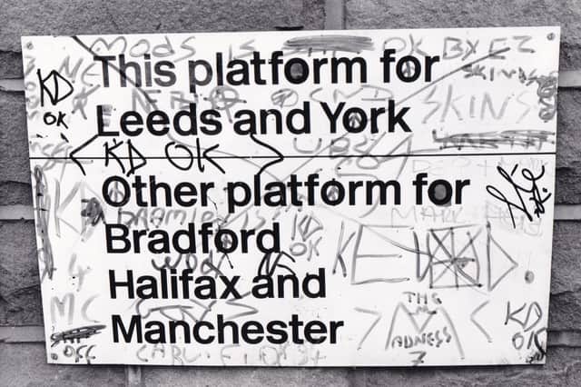 Graffiti makes a maze of the platform sign in December 1984.