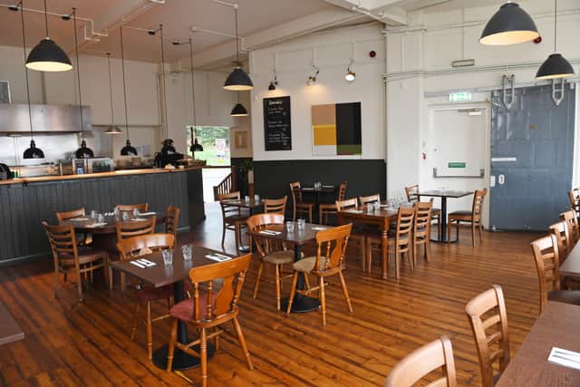 The dining area with a view of the kitchen.
