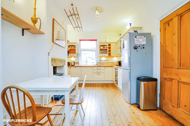 The kitchen forms part of an open-plan lounge for sociable modern living