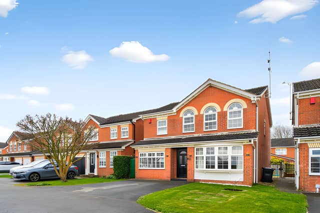 The detached home makes an immediate impression from its frontage, with ample off-street parking adding practical appeal