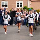 Sir Kevin Sinfield (centre) is joined by Sir Gareth Southgate as he arrives at Shiptonthorpe Village Hall at the end of day one of the 7 in 7: The Grand Finale 2026 Challenge