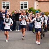 Sir Kevin Sinfield (centre) is joined by Sir Gareth Southgate as he arrives at Shiptonthorpe Village Hall at the end of day one of the 7 in 7: The Grand Finale 2026 Challenge
