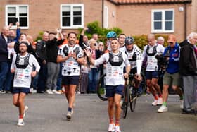 Sir Kevin Sinfield (centre) is joined by Sir Gareth Southgate as he arrives at Shiptonthorpe Village Hall at the end of day one of the 7 in 7: The Grand Finale 2026 Challenge