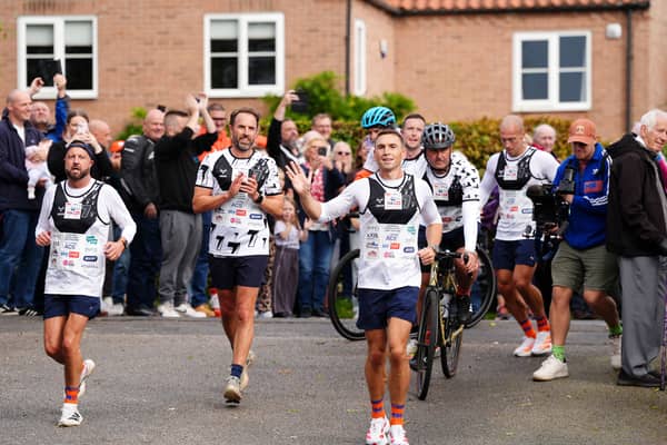 Sir Kevin Sinfield (centre) is joined by Sir Gareth Southgate as he arrives at Shiptonthorpe Village Hall at the end of day one of the 7 in 7: The Grand Finale 2026 Challenge