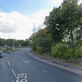 A busy south Leeds route has been closed in both directions following a collision involving a motorcycle and a recovery truck, causing severe traffic delays and bus diversions