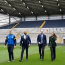 The Prince and Princess of Wales, walk with Jamie Jones Buchanan, CEO of the Leeds Rhinos and a lifelong friend of Rob Burrow, during a visit to the Leeds Rhinos at the AMT Headingley Rugby Stadium
