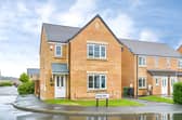 The detached home on Scatcherd Drive comes with a garage and driveway, adding practical features to its family-focused layout