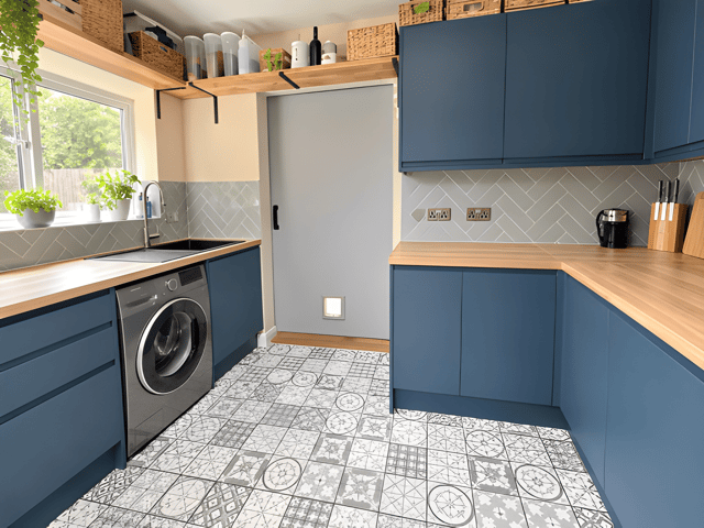 Navy units and solid wood worktops give the contemporary kitchen a distinctive finish alongside its adjoining dining space