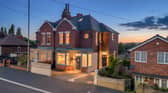 The Green Hill Road property has ample off-road parking to both the front and rear, adding practical space to the substantial four-floor home