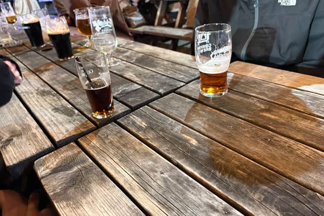 Pints of beer on the bench in the outdoor seating area of Brudenell Social Club