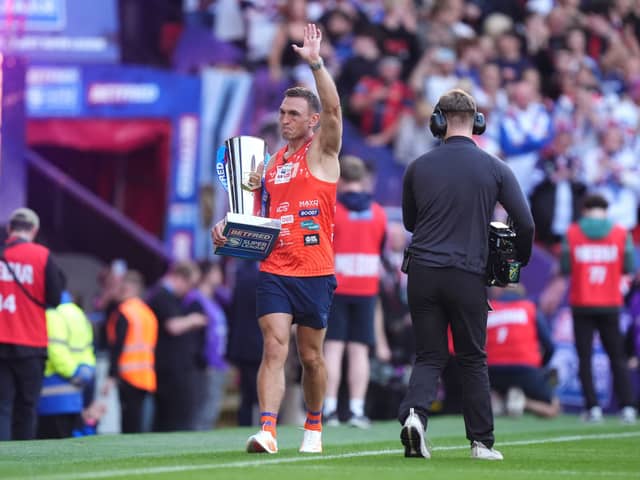 Sir Kevin Sinfield brings out the trophy ahead of the Betfred Super League Grand Final at Old Trafford, Manchester.