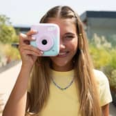 The camera lets users take multiple pictures before choosing which ones to print out 