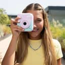 The camera lets users take multiple pictures before choosing which ones to print out 