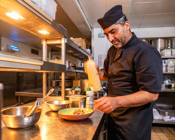 Chef of the week - Cinnamon Kitchen at the Queen Hotel, Leeds. Pictured Head chef Tariq Ghumman preparing a starter dish Hakka Paneer - Stir-Fry Honey, Sesame, Soy and Chilli. Picture: James Hardisty. Date: 8th October 2026.