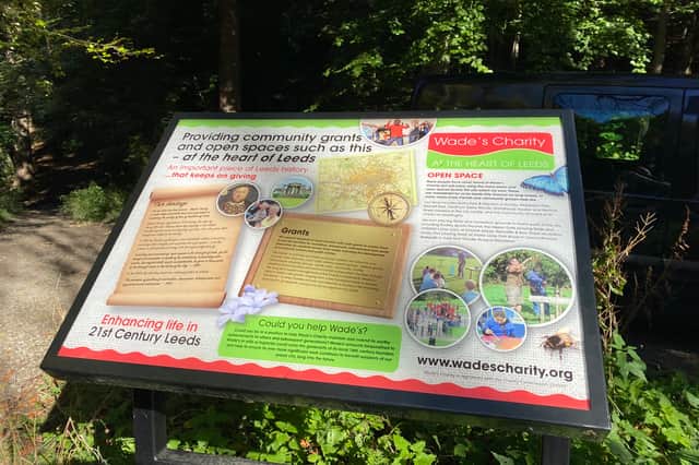 A board explaining the work of Wade's Charity.