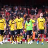 ONE THAT GOT AWAY: As Leeds United's players show their disappointment at Arsenal.
