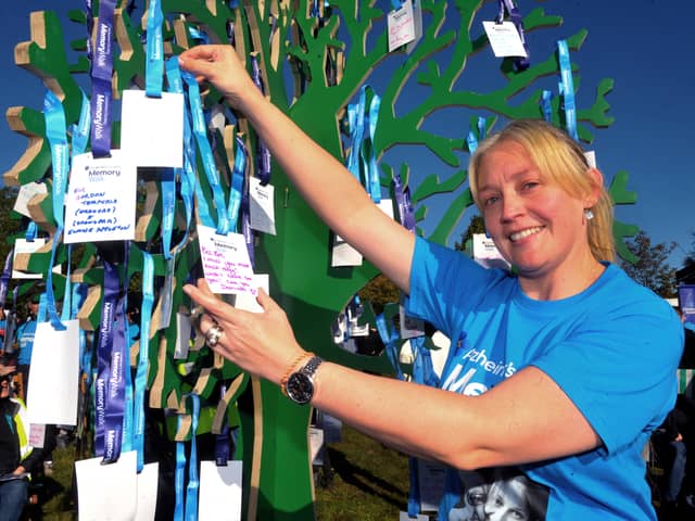 Alzheimer's Society Memory Walk at Temple Newsam House, sun 11-10-2026 pic Steve Riding
Dorrinda Graham of Thirsk puts a card for Nana Betty Jackson on the Memory Tree