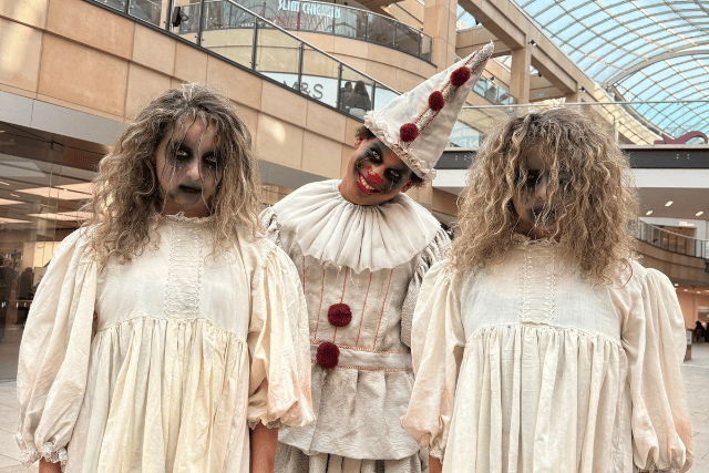 Freaky and fantastical: Creepy twins and a haunting clown prepare to stalk through Trinity Leeds during the first-ever Halloween Spooktacular Parade