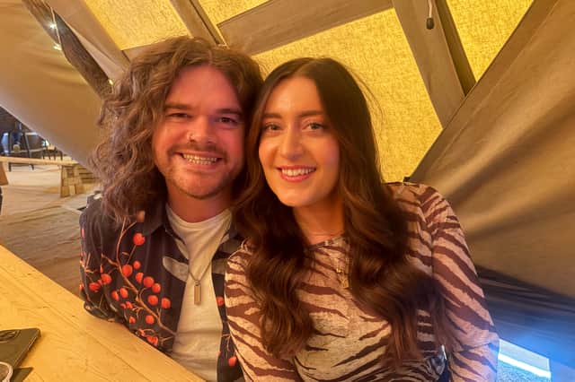 Alex Duncan and Ella Sidey enjoying the music inside the Oktoberfest tipee