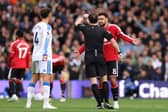 Referee Darren England tried to let pay go at Elland Road on Sunday.