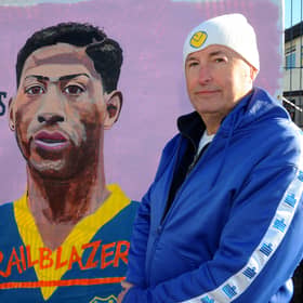 Robert Endeacott unveiling his latest mural - Gerry Francis, the first black player to play for Leeds United, which is on display at the new Fan Zone opposite the South Stand