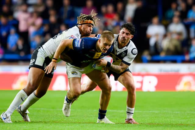 New Leeds Rhinos signing Hugo Salabio, left tackles future teammate Cooper Jenkins at Headingley last season. Picture by Allan McKenzie/SWpix.com.
