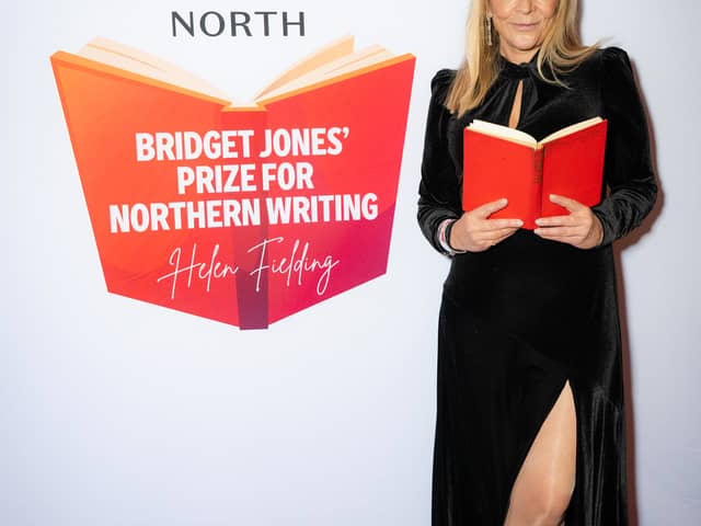Morley-born author Helen Fielding holding an open book at the launch of the Bridget Jones Prize for Northern Comedy Writing in partnership with New Writing North