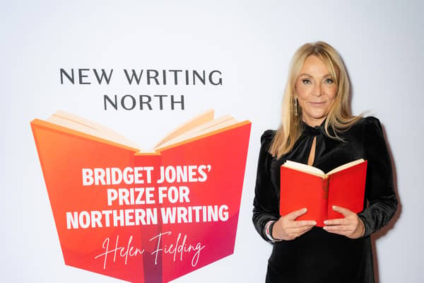 Morley-born author Helen Fielding holding an open book at the launch of the Bridget Jones Prize for Northern Comedy Writing in partnership with New Writing North