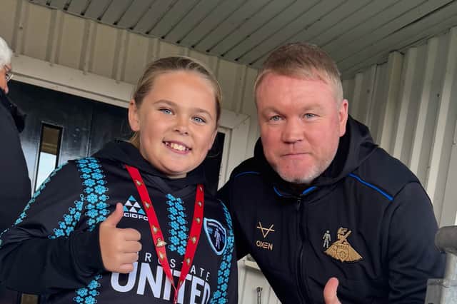 Freya with Doncaster manager Grant McCann who is taking part in the Prostate United challenge