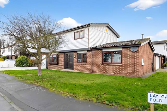 This detached Rothwell home combines a substantial family layout with a double garage and off-street parking
