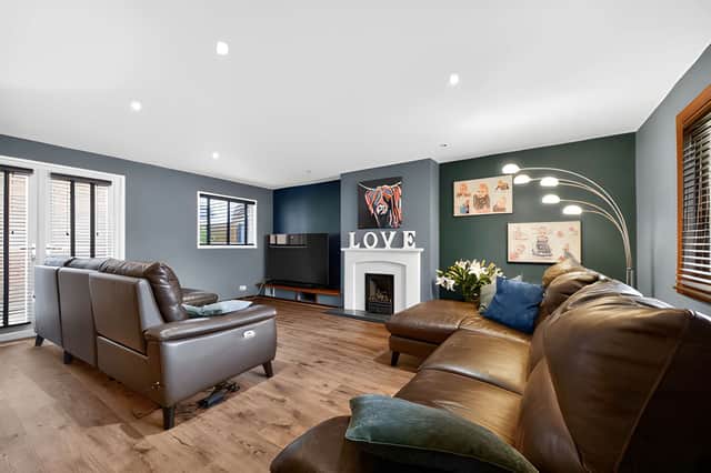 The through lounge is one of three reception rooms